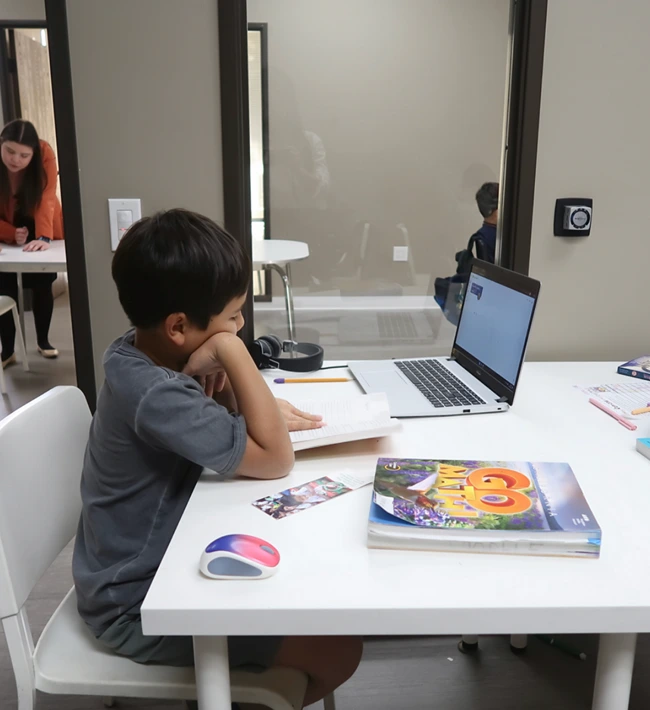 Six smiling, diverse students giving peace signs in an engaging our after-school programs